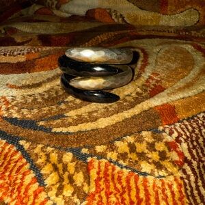 Black and gold tone bracelet that will not fall off with your wrist.